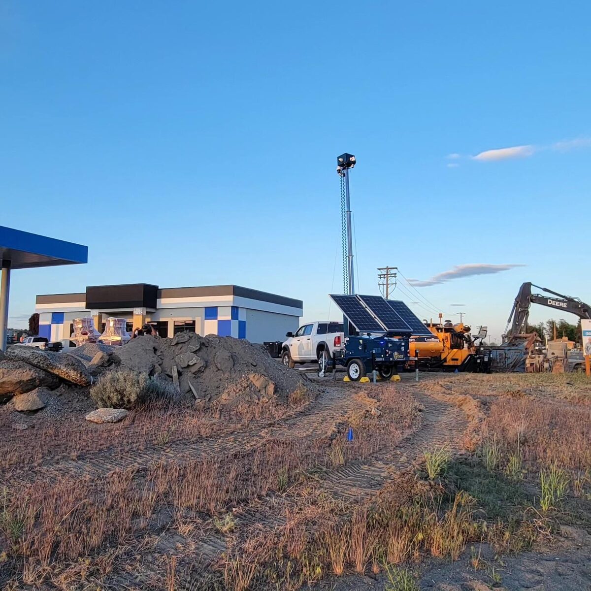 SOS Sentinel unit at commercial project with paver and excavator